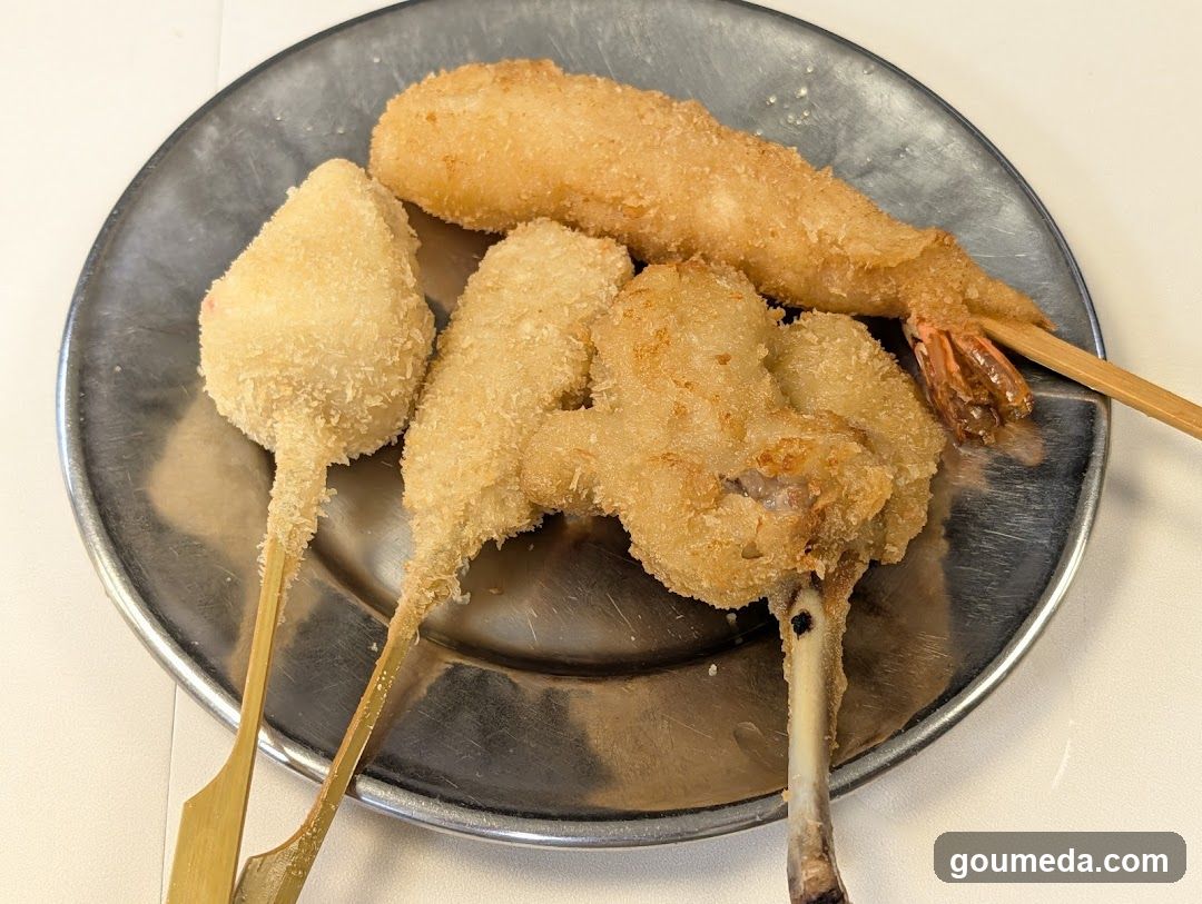 Fried Seafood Skewers on Metal Plate