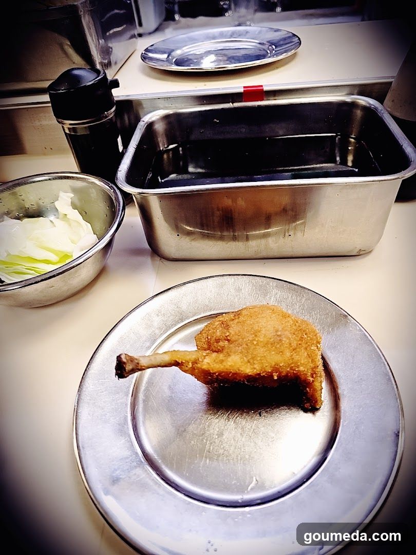 Fried Chicken Leg on Metal Plate