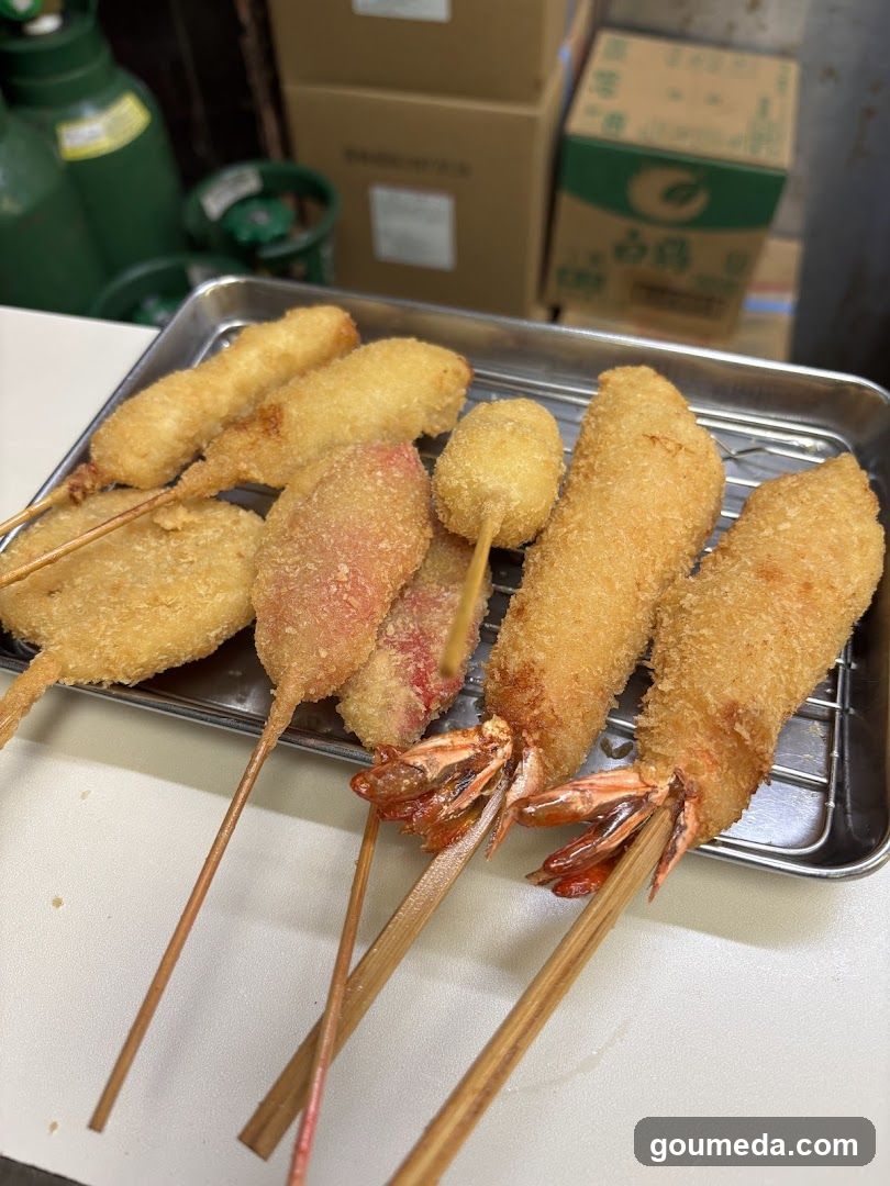 Fried Seafood Skewers on a Metal Tray
