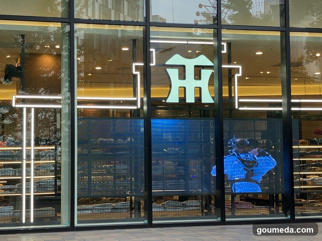 Storefront with illuminated logo and glass facade