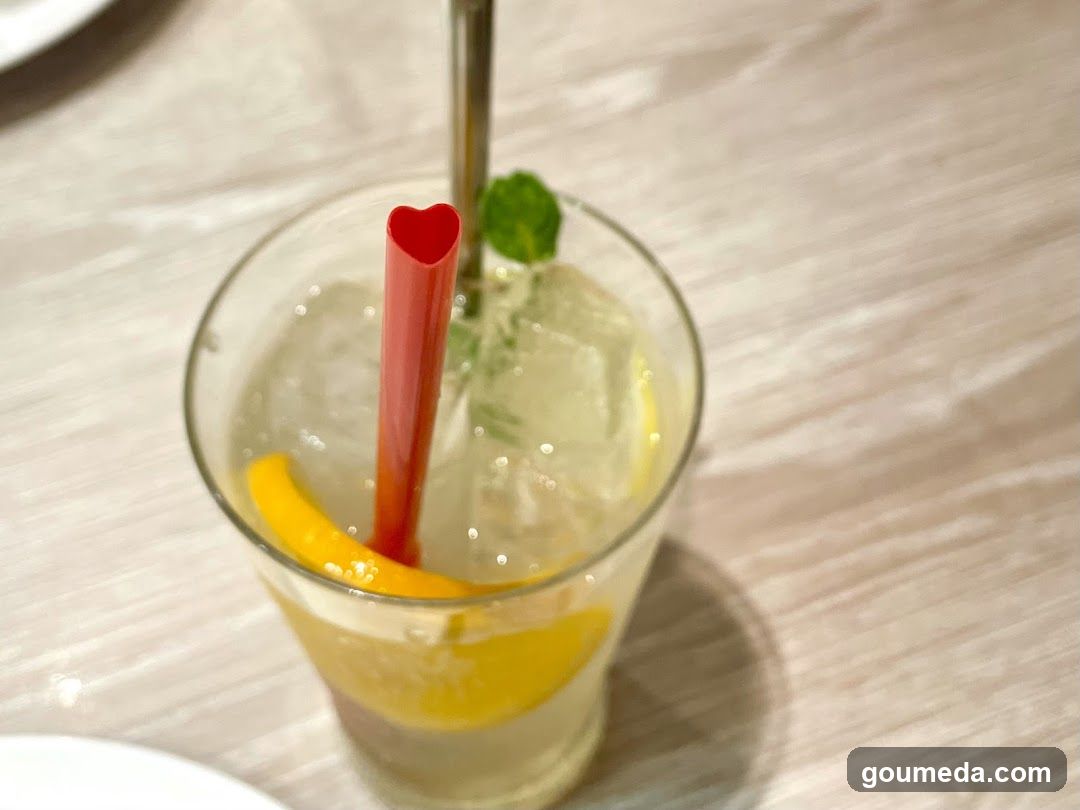 Heart-Shaped Straw Drink with Lemon and Mint
