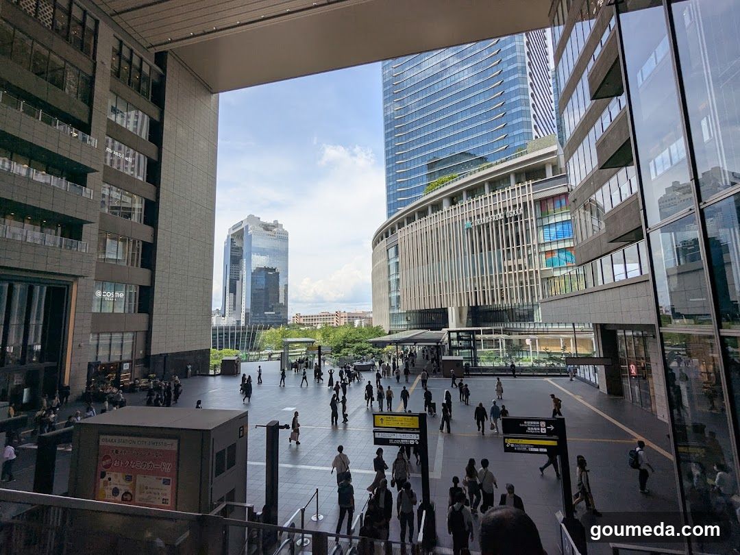 Urban plaza with pedestrians and modern buildings