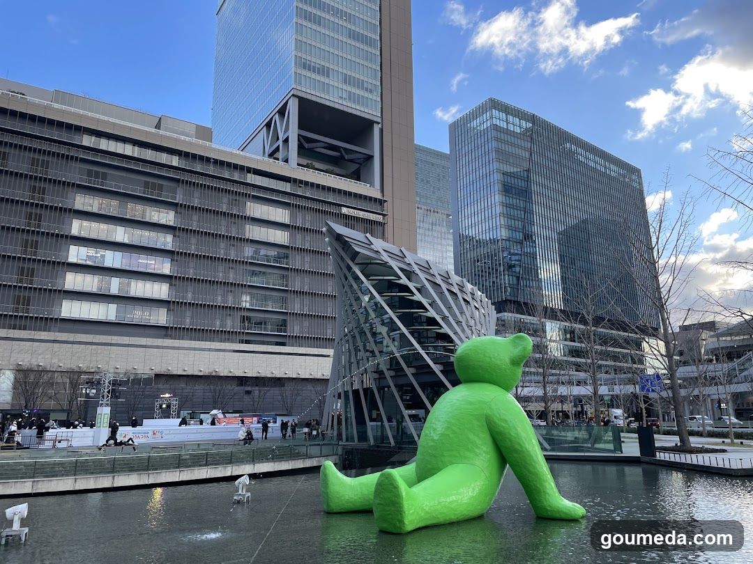 Green Bear Sculpture in Urban Plaza
