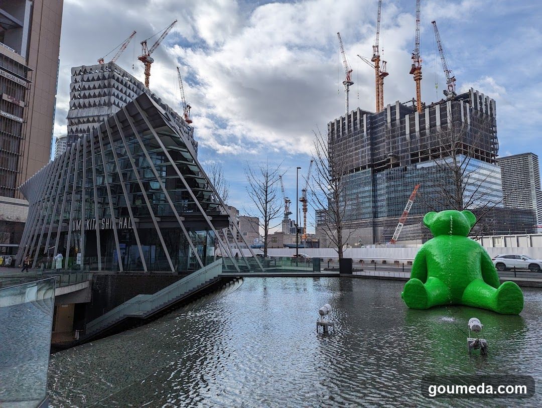 Urban Construction Scene with Green Bear Sculpture