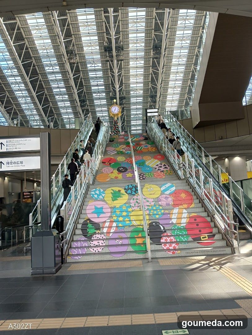Staircase with colorful circular art in a train station