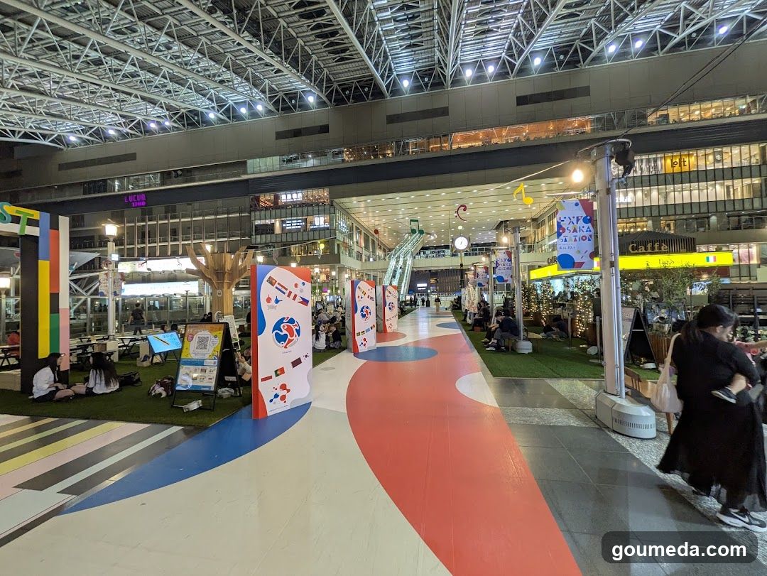 Colorful indoor plaza with art installations and seating areas