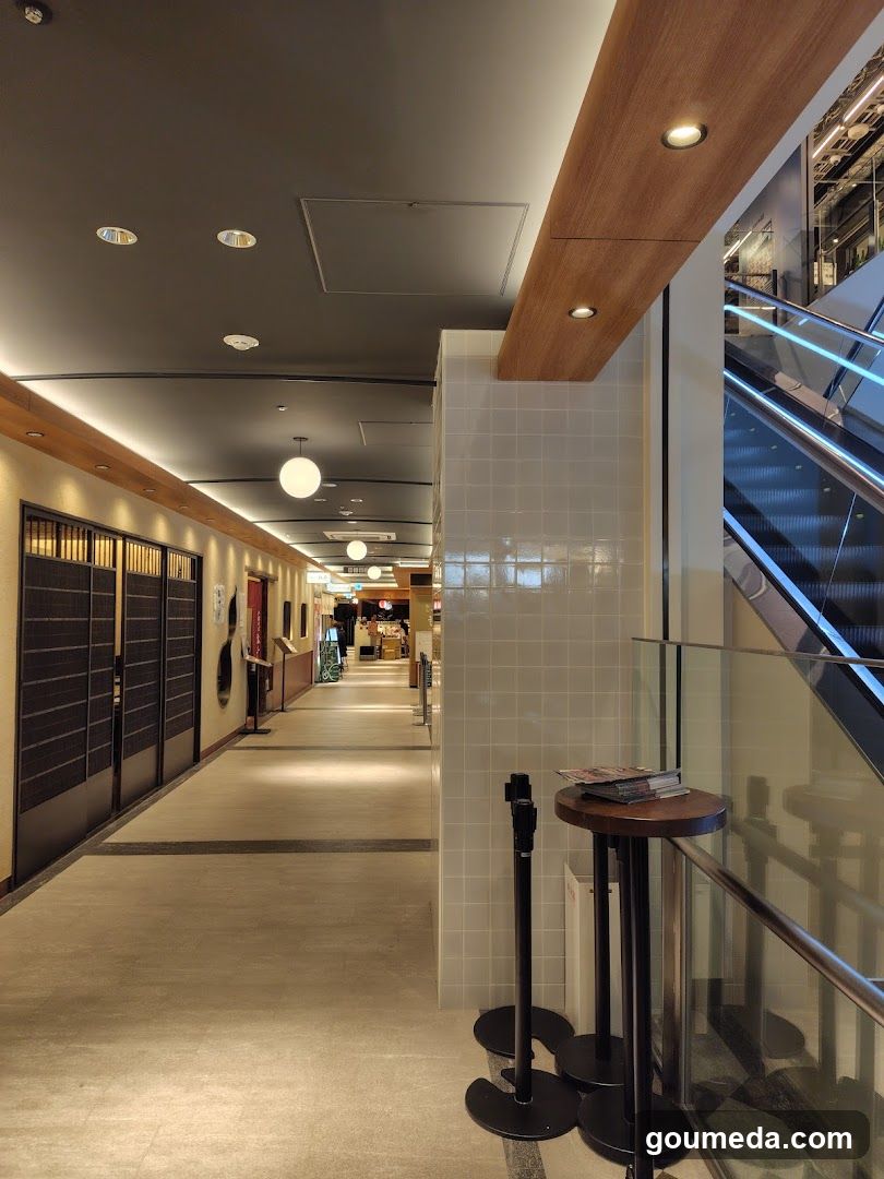 Interior Corridor with Staircase and Shop Entrance
