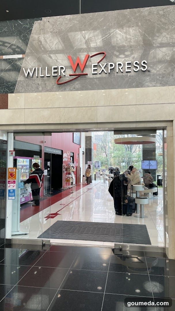 Photo of the physical exterior entrance and storefront facade of a Willer Express store, with visible signage on the building.
