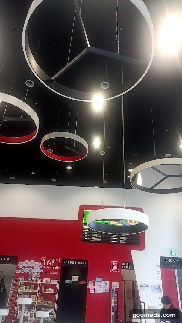 Interior of a modern shop with hanging lights and signage