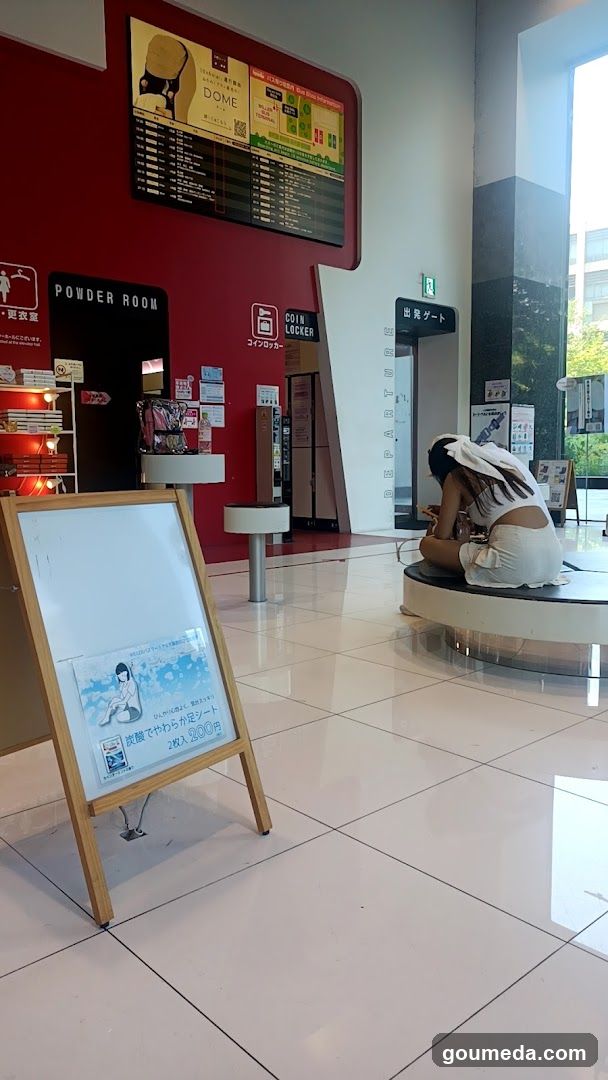 Interior of a public facility with signage and seating area