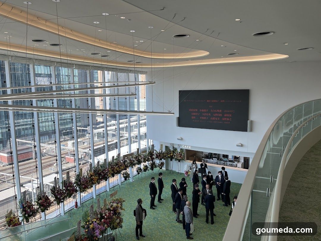 Event Hall Interior with Floral Decorations and Digital Display