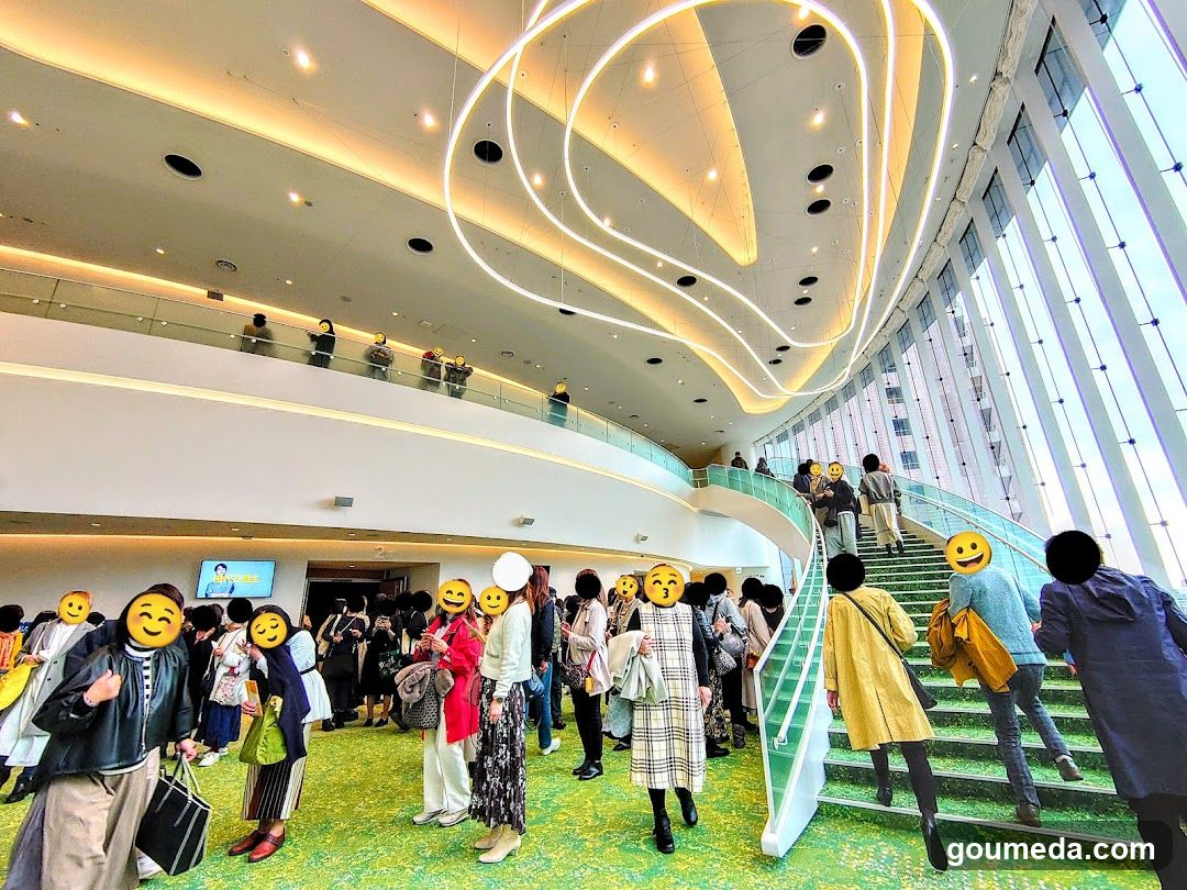 Crowded Interior with Emoji Masks