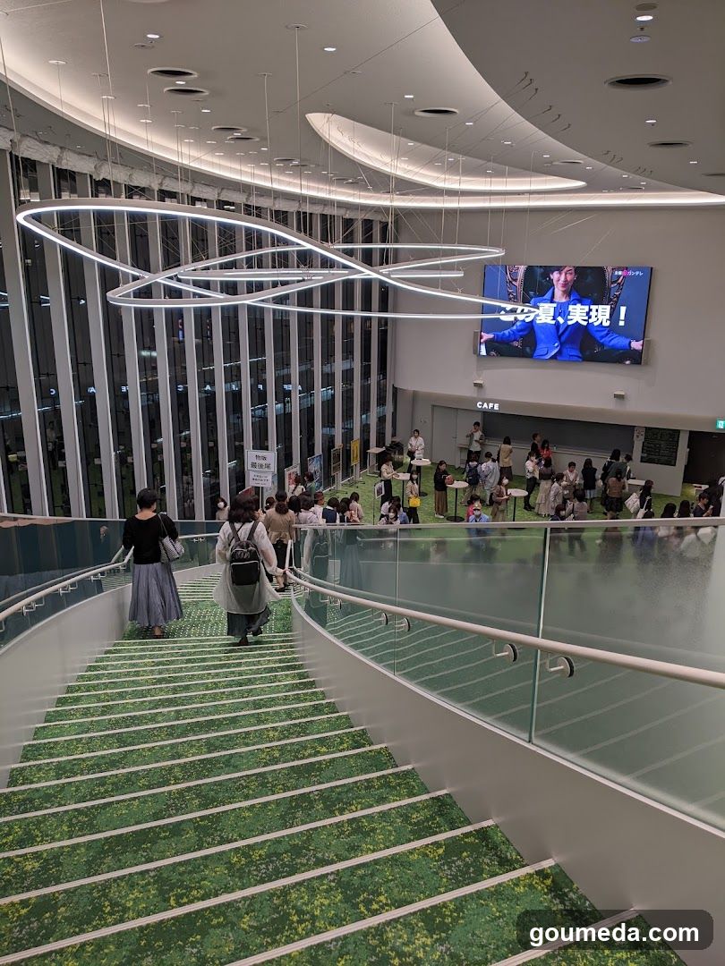 Modern Interior with Green Staircase and Large Screen