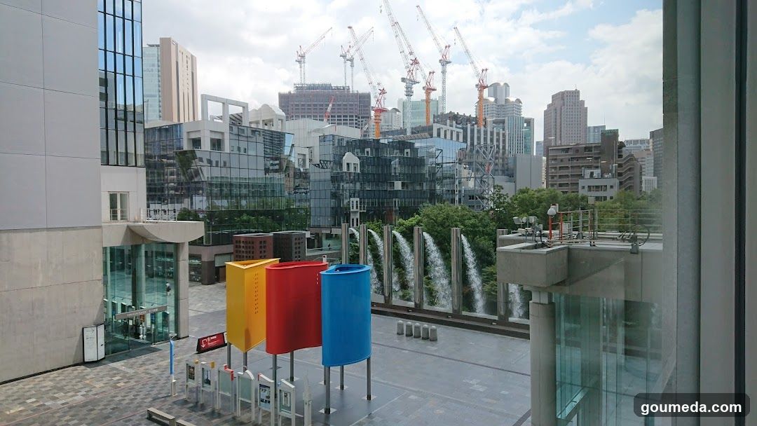 Urban Skyline with Construction Cranes and Colorful Structures