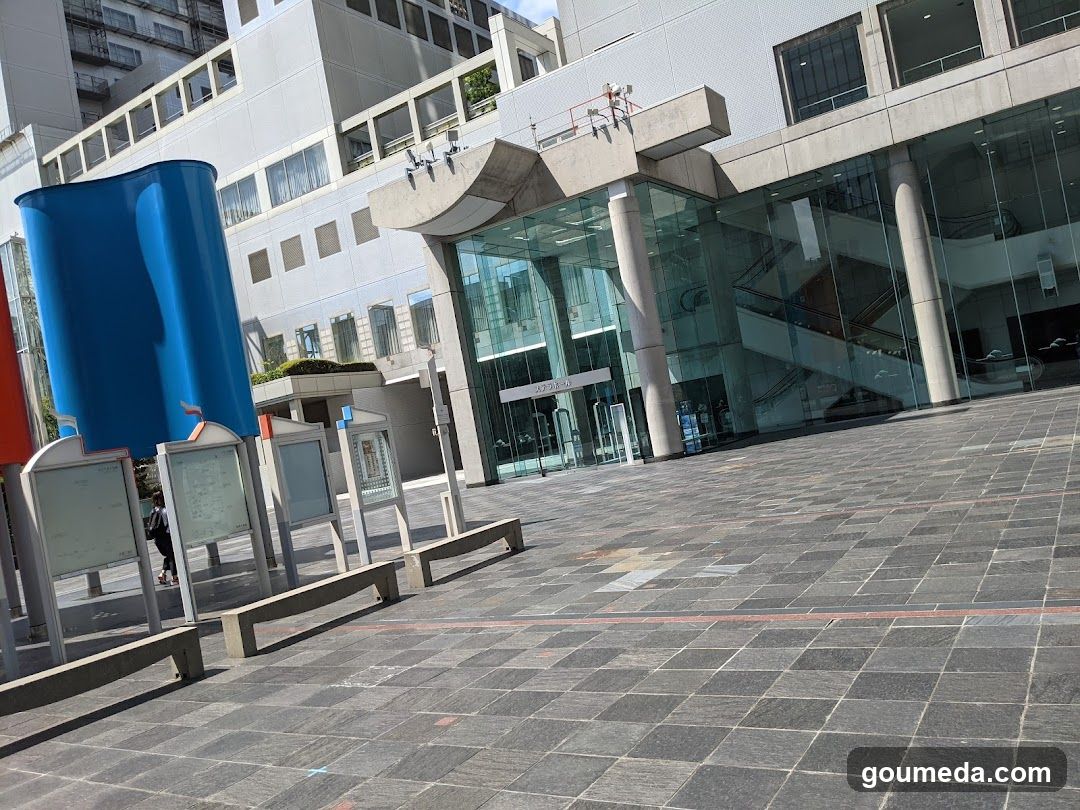 Modern Building Entrance with Blue Sculpture