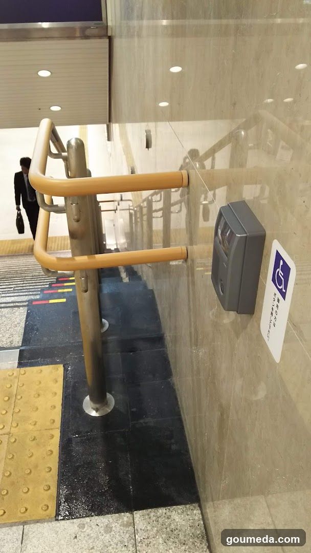 Staircase with Handrail and Accessible Sign