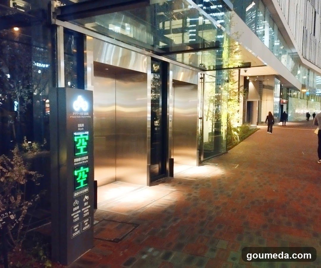 Nighttime Building Entrance with Elevator Signage