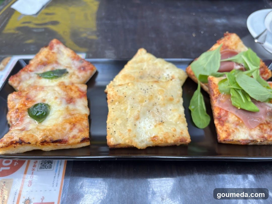 Pizza Slices on Black Plate
