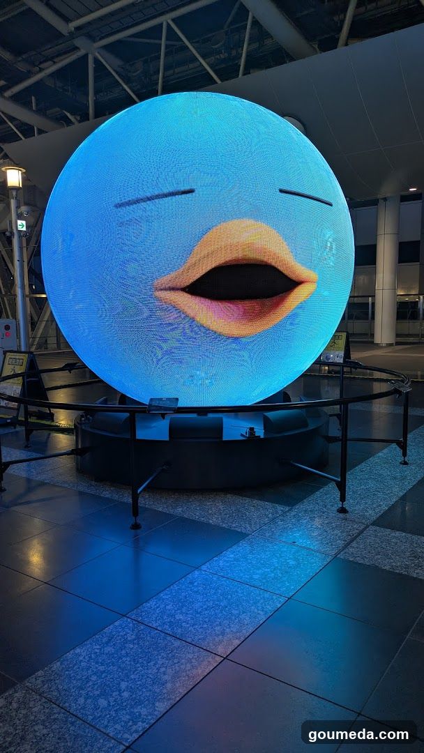 Blue Sphere Display with Open Mouth