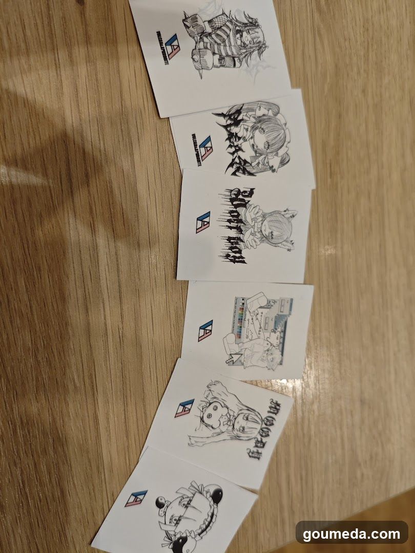 Anime-style sticker collection on wooden surface