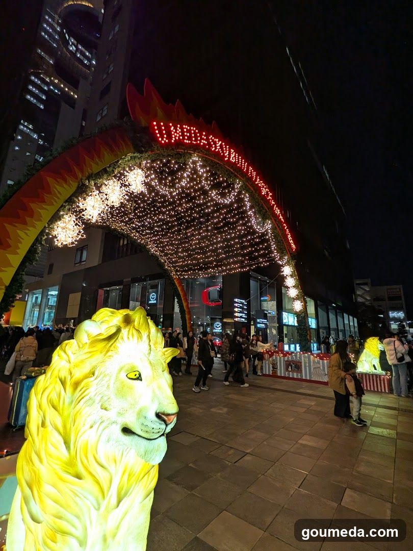 Night scene with illuminated lion statue and archway