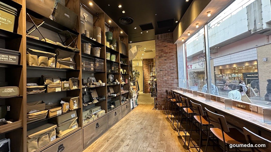 Interior of a retail store with wooden shelves and bar seating