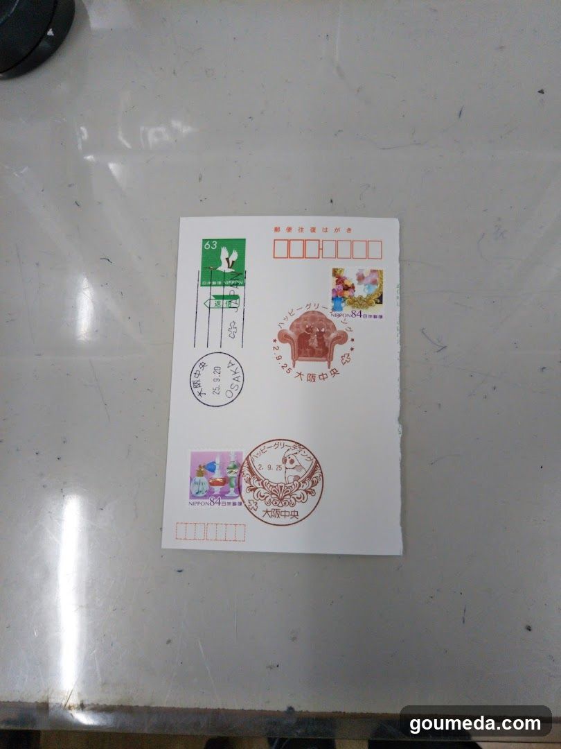 Japanese Postal Envelope with Stamps and Postmarks