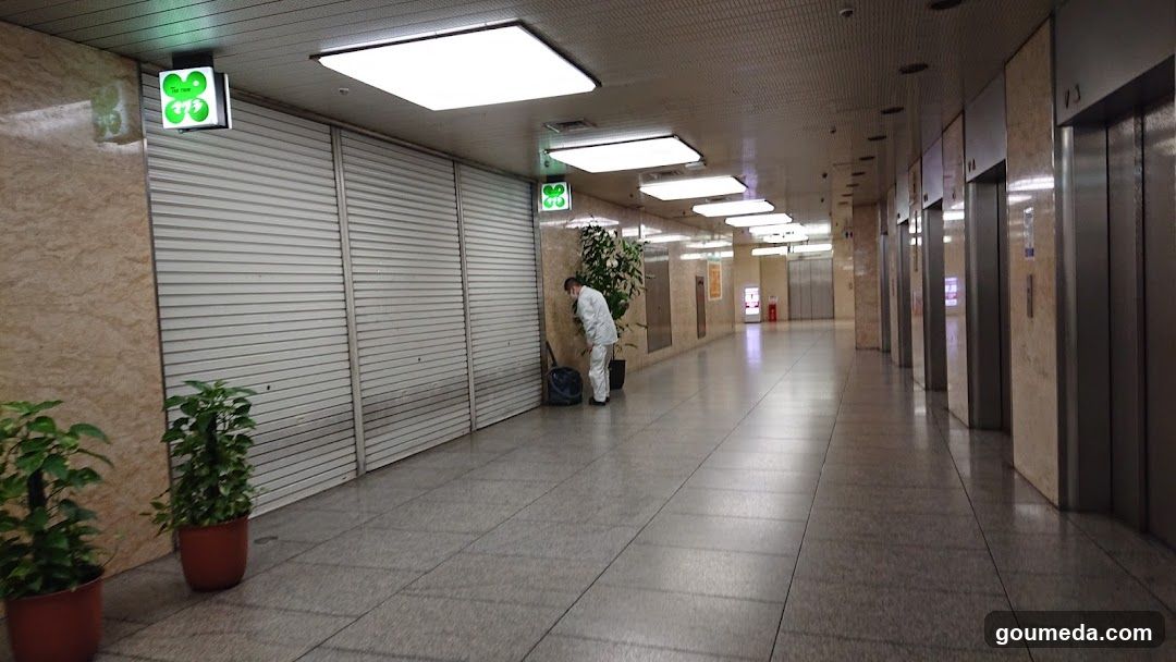 Empty Corridor with Closed Storefronts