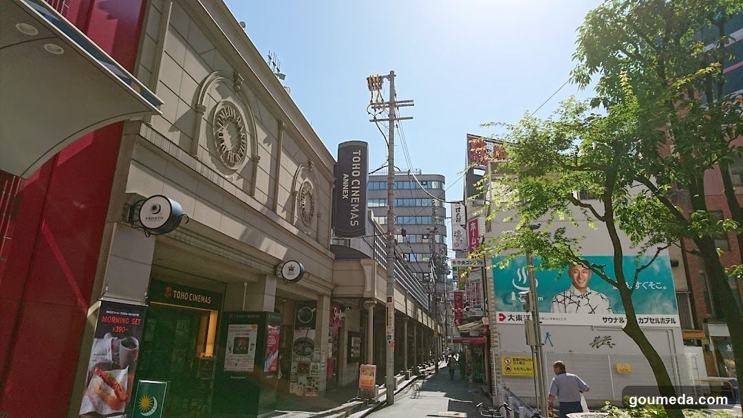 Street scene with shops and signs