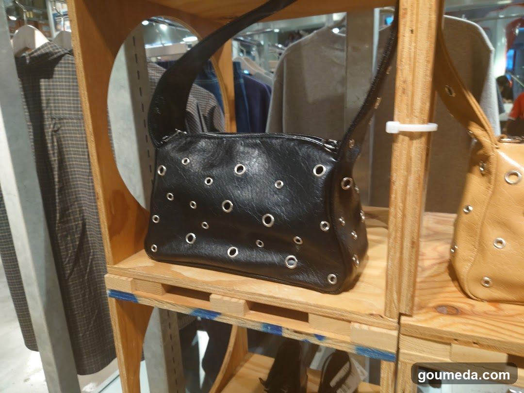 Black and Tan Studded Handbags on Display
