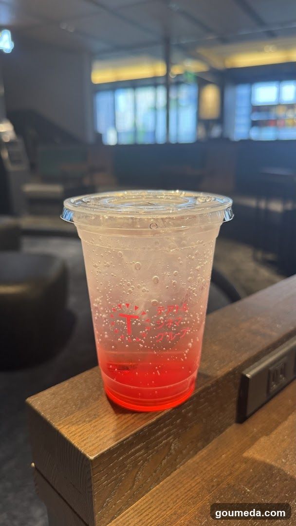 Red drink in plastic cup
