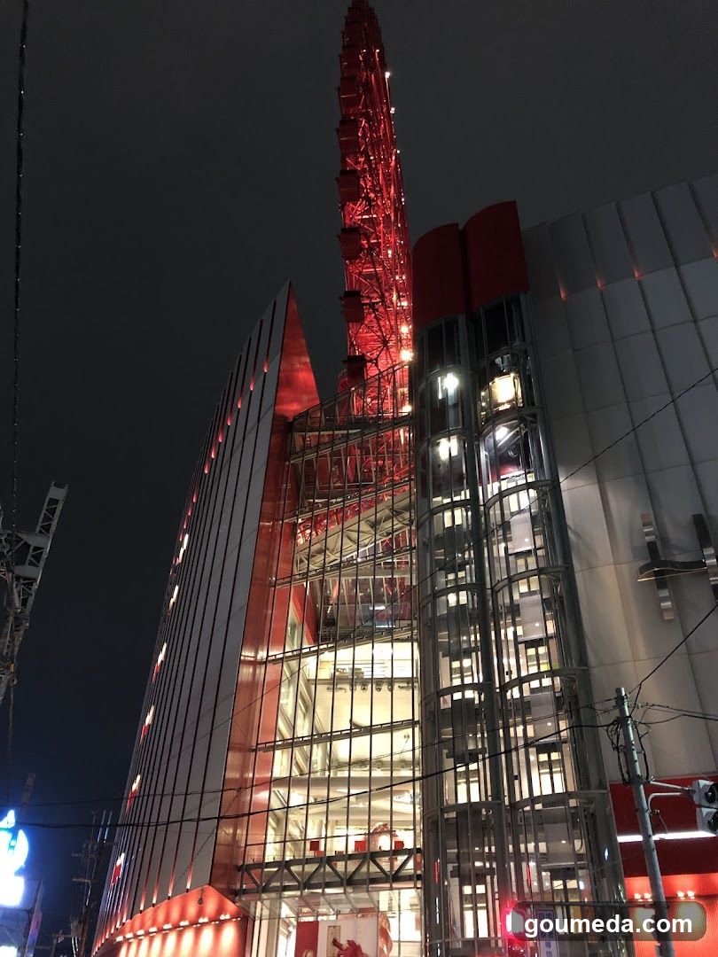 Night view of a modern building with red tower