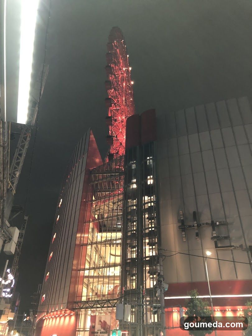 Night view of illuminated tower and building facade