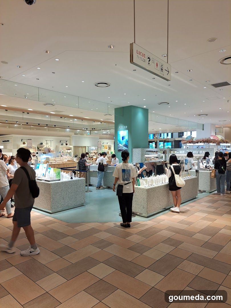 Interior of a retail store with customers browsing products at counters.