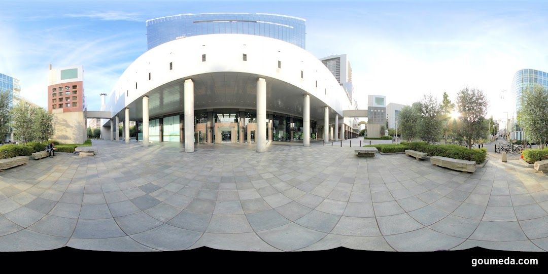 Modern Building Exterior with Columns and Paved Plaza