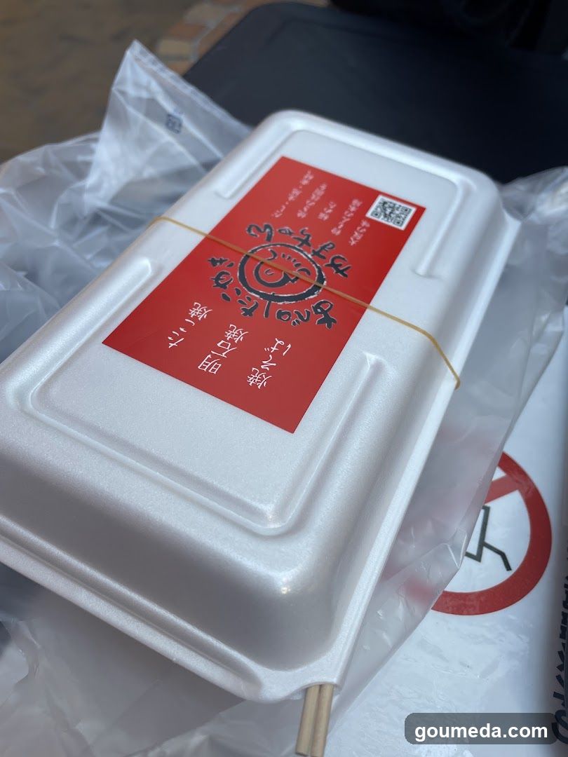 Takeout food container with red label