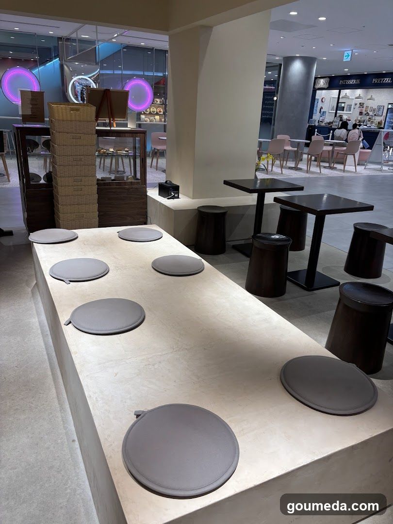 Interior seating area with round cushions and tables