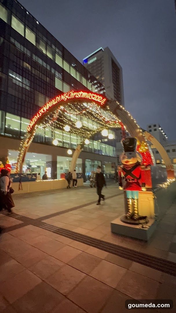 Night scene with illuminated archway and nutcracker statue