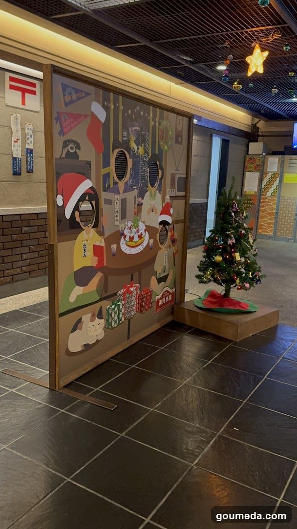 Christmas-themed indoor display with mural and tree
