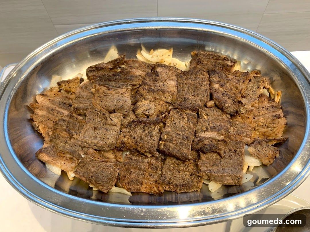 Grilled Meat Dish in Metal Bowl