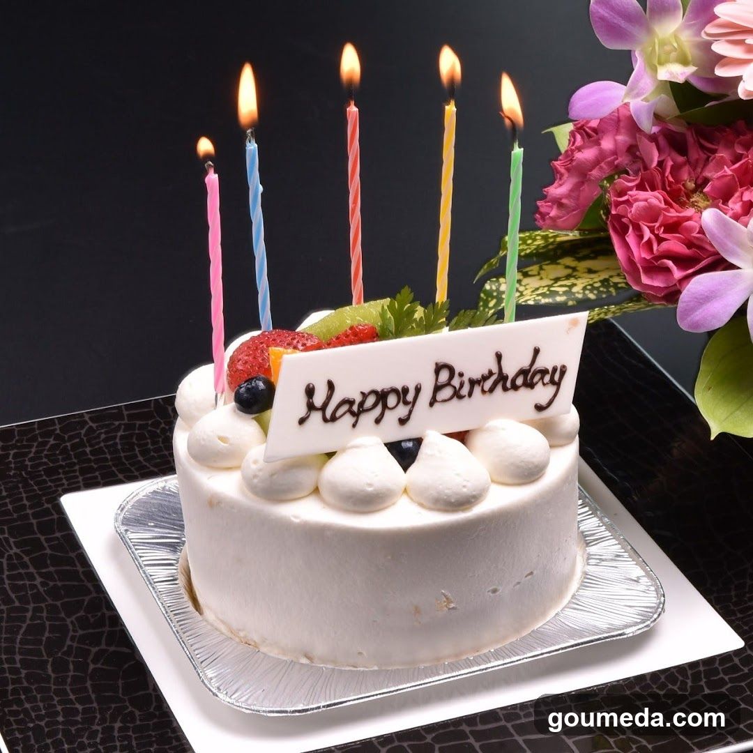 Birthday Cake with Candles and Flowers