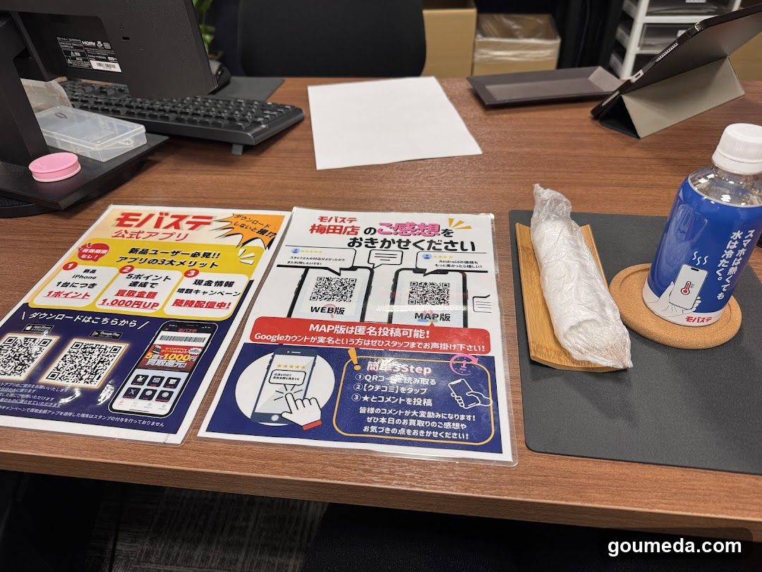 Office Desk with Promotional Flyers and Drink