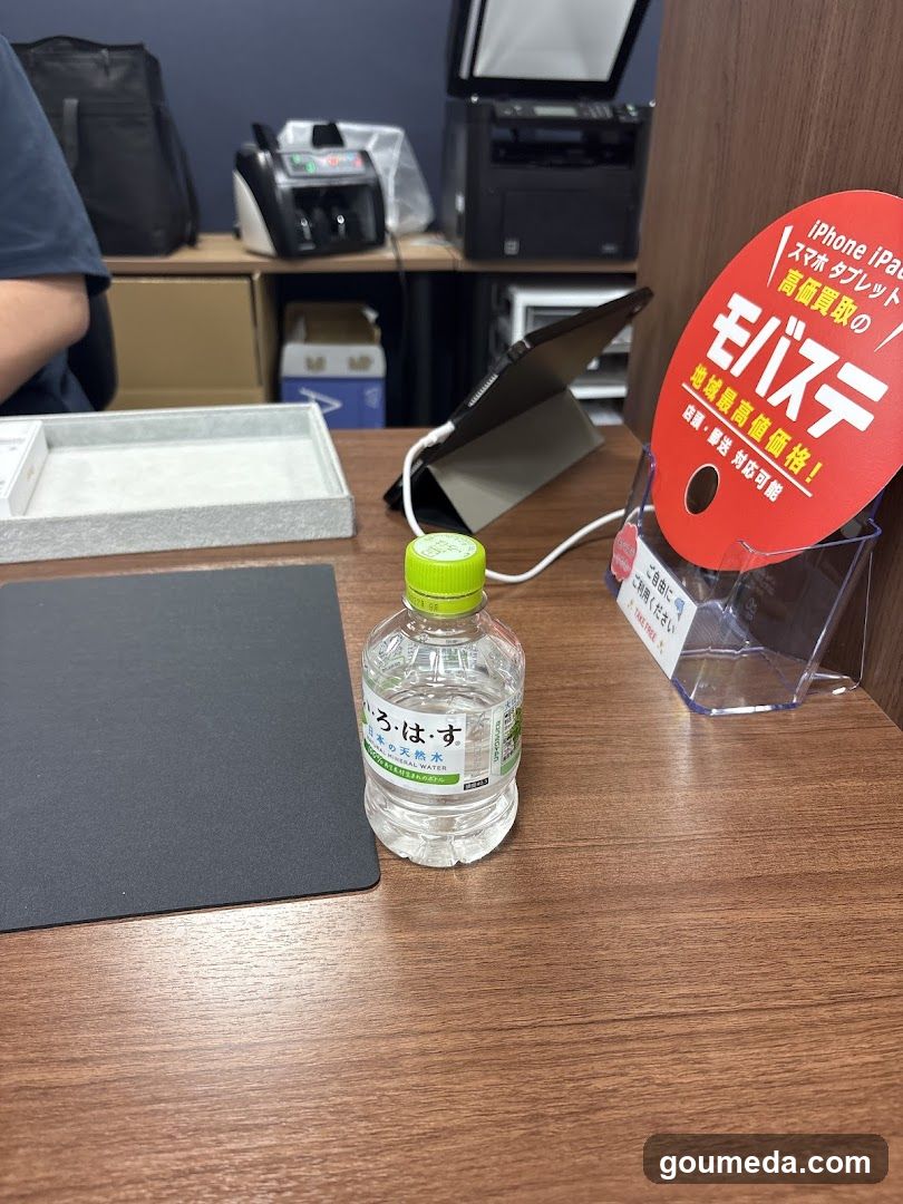 Office Desk Setup with Water Bottle and Signage